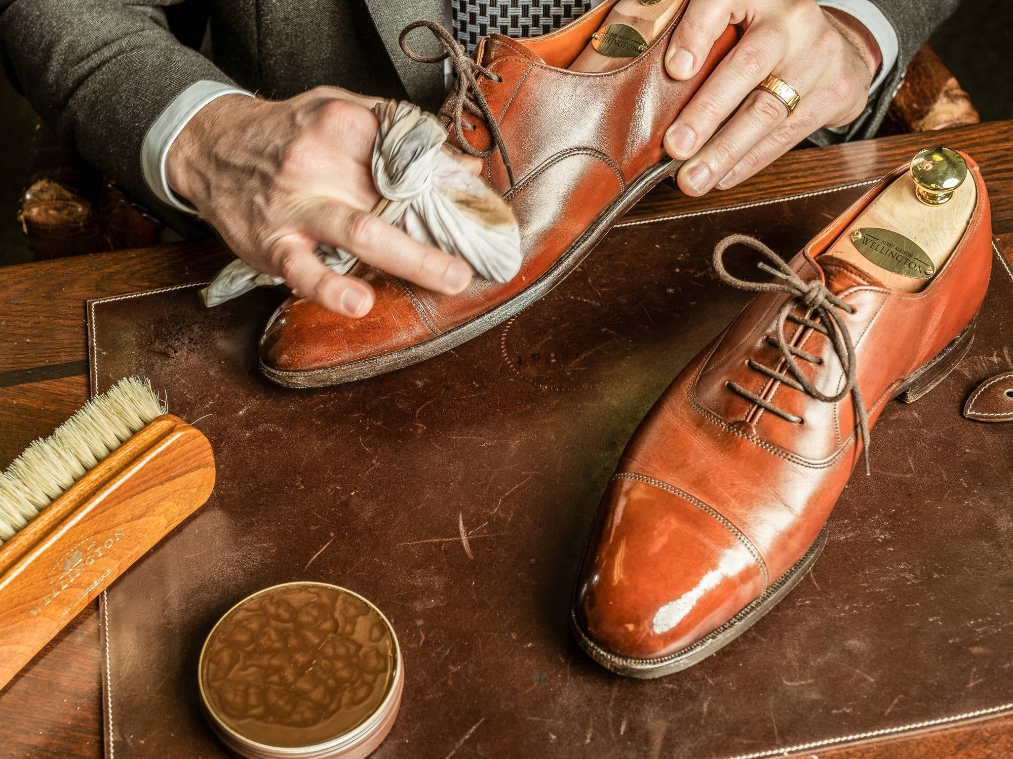 hands polishing fancy leather shoe