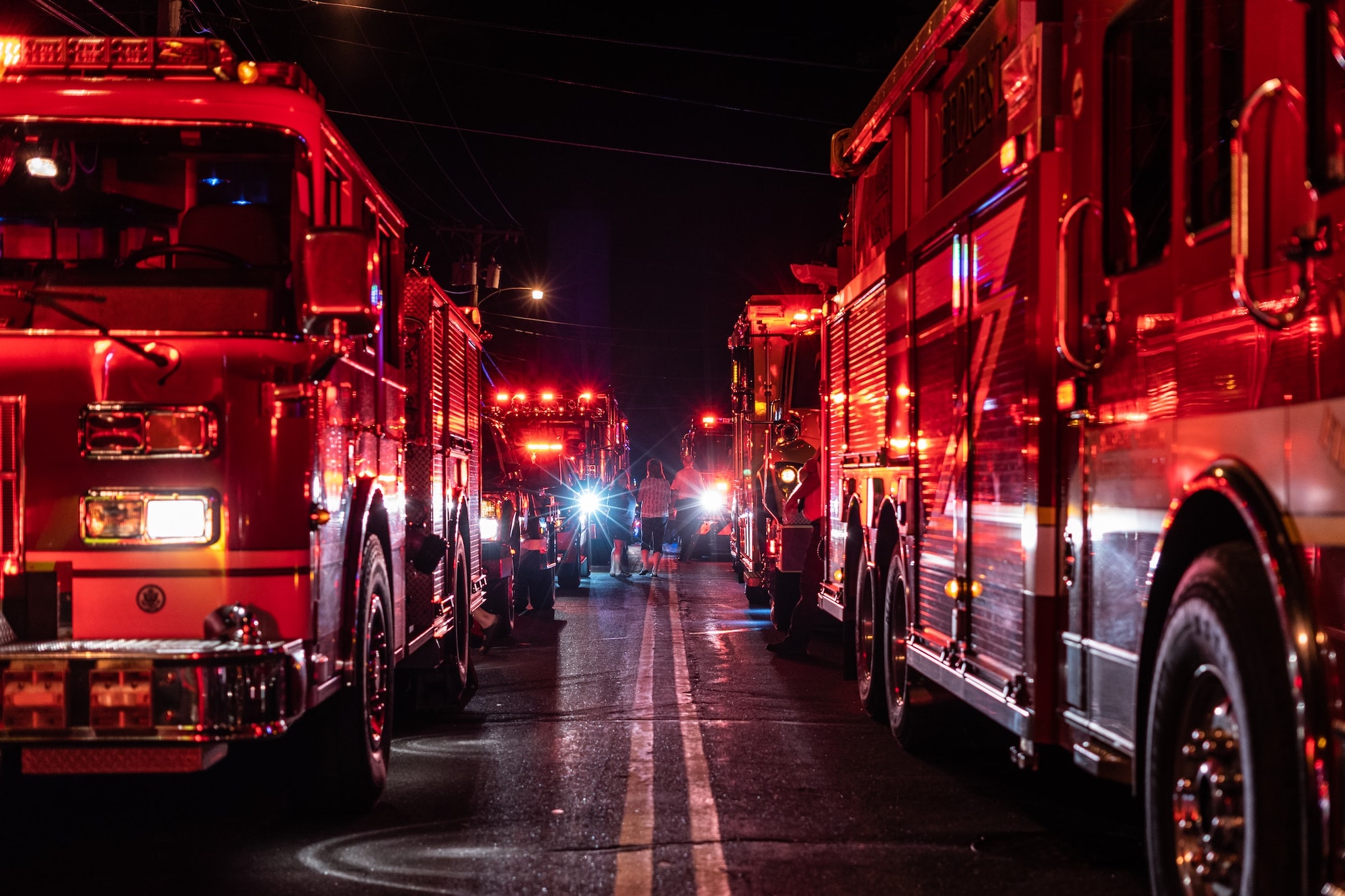 fire trucks lines up on a road