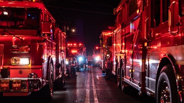 fire trucks lines up on a road