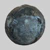 A bluish-black rock about the size of a tennis ball.