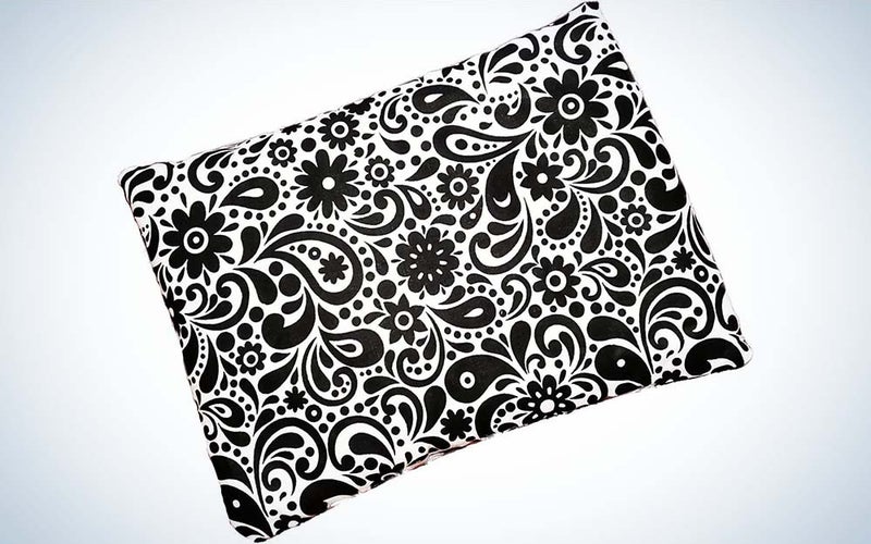 A black-and-white flowered print design on the cover of a heating pad made by Caylee's Creations.