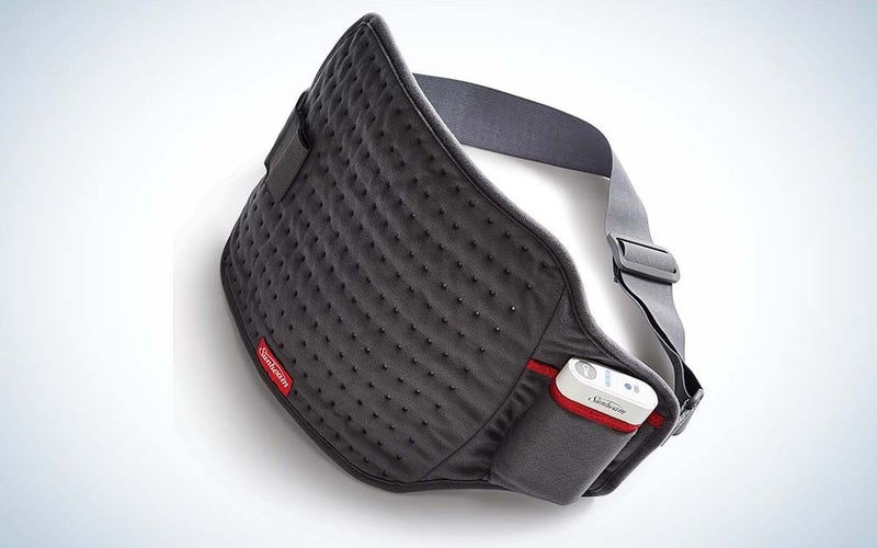 The black cordless heating pad from Sunbeam features an adjustable gray strap.