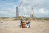 Boca Chica beach cleanup with SpaceX construction in background