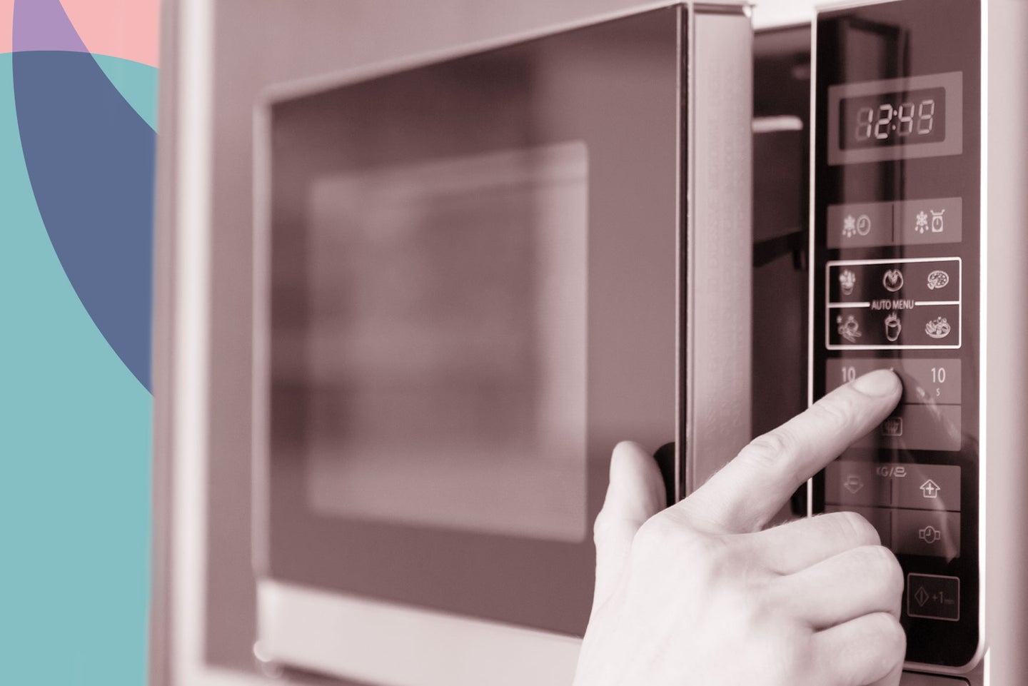 person pressing buttons on a microwave oven