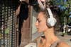 Pioneer DJ HDJ-CUE1BT headphones on woman's head