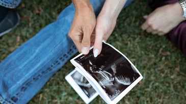 Expecting parents holding an ultrasound
