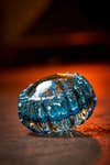 a gem-like chunk of ribbed blue glass