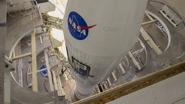A top-looking-down photo of a rocket with the blue NASA logo.