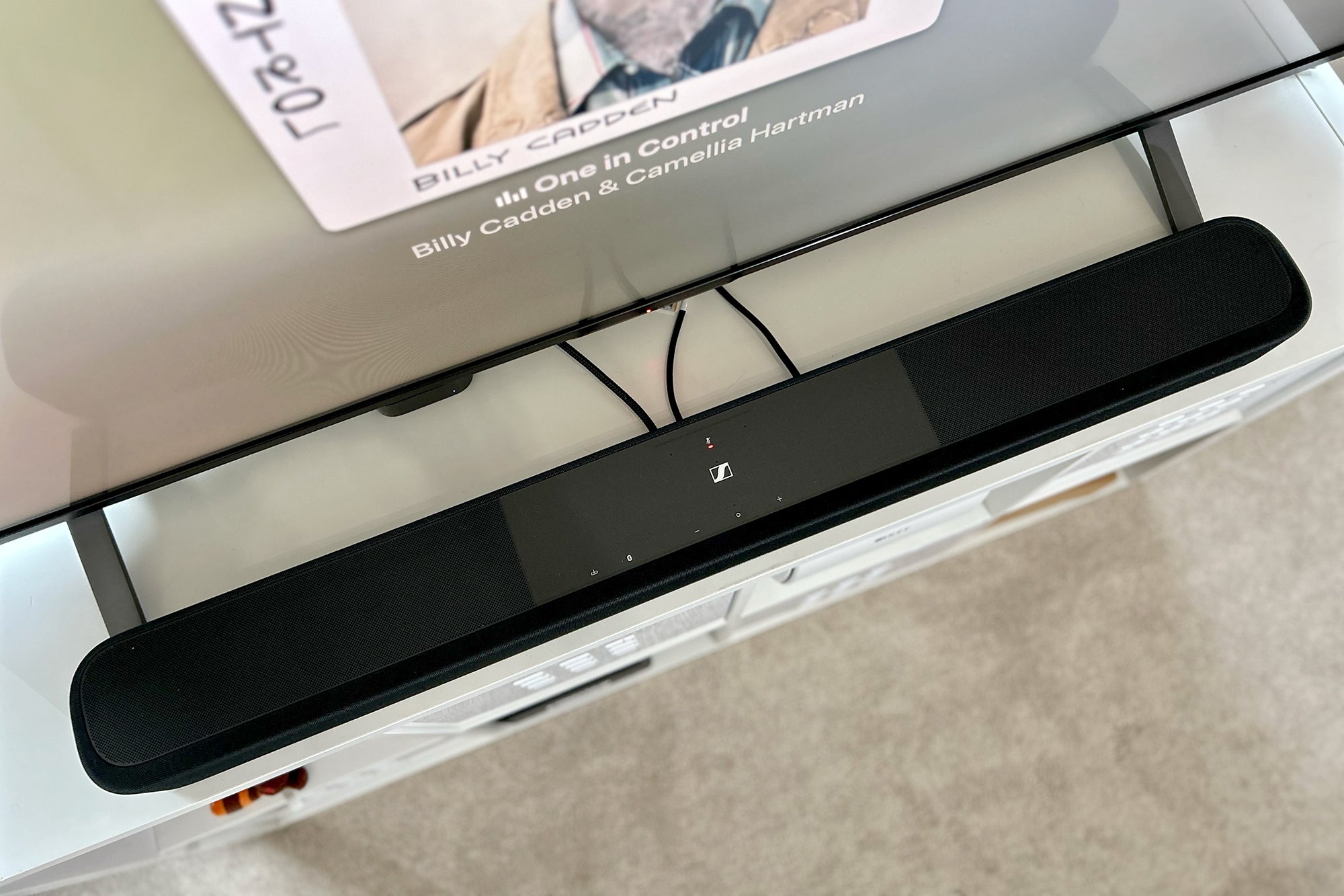 Sennheiser AMBEO Plus best overall soundbar in front of a TV playing Billy Cadden