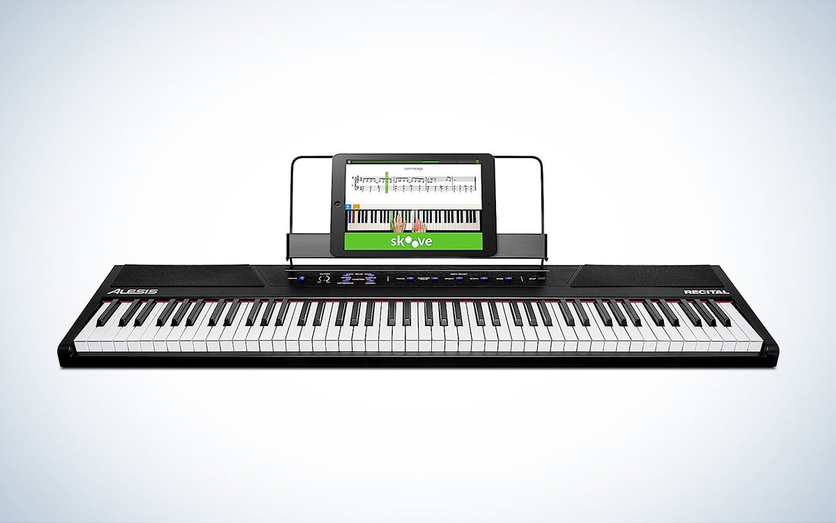 The Alesis Recital 88-key beginner keyboard is placed against a white background with a gray gradient.