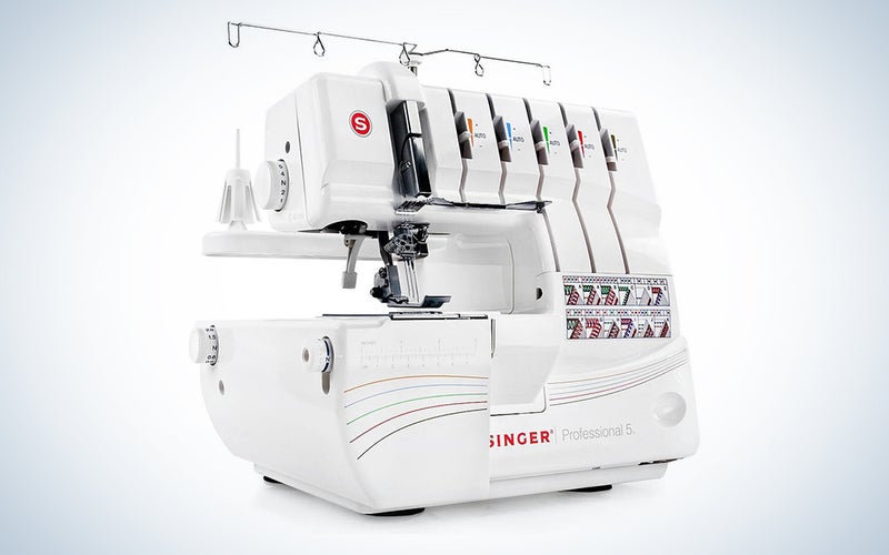 A professional-grade sewing machine on a blue and white background