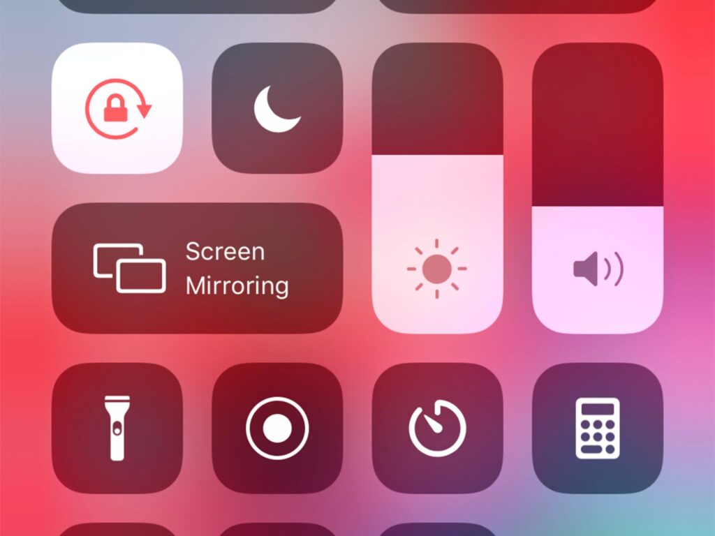 The iOS Control Center with Screen Mirroring and other tools.