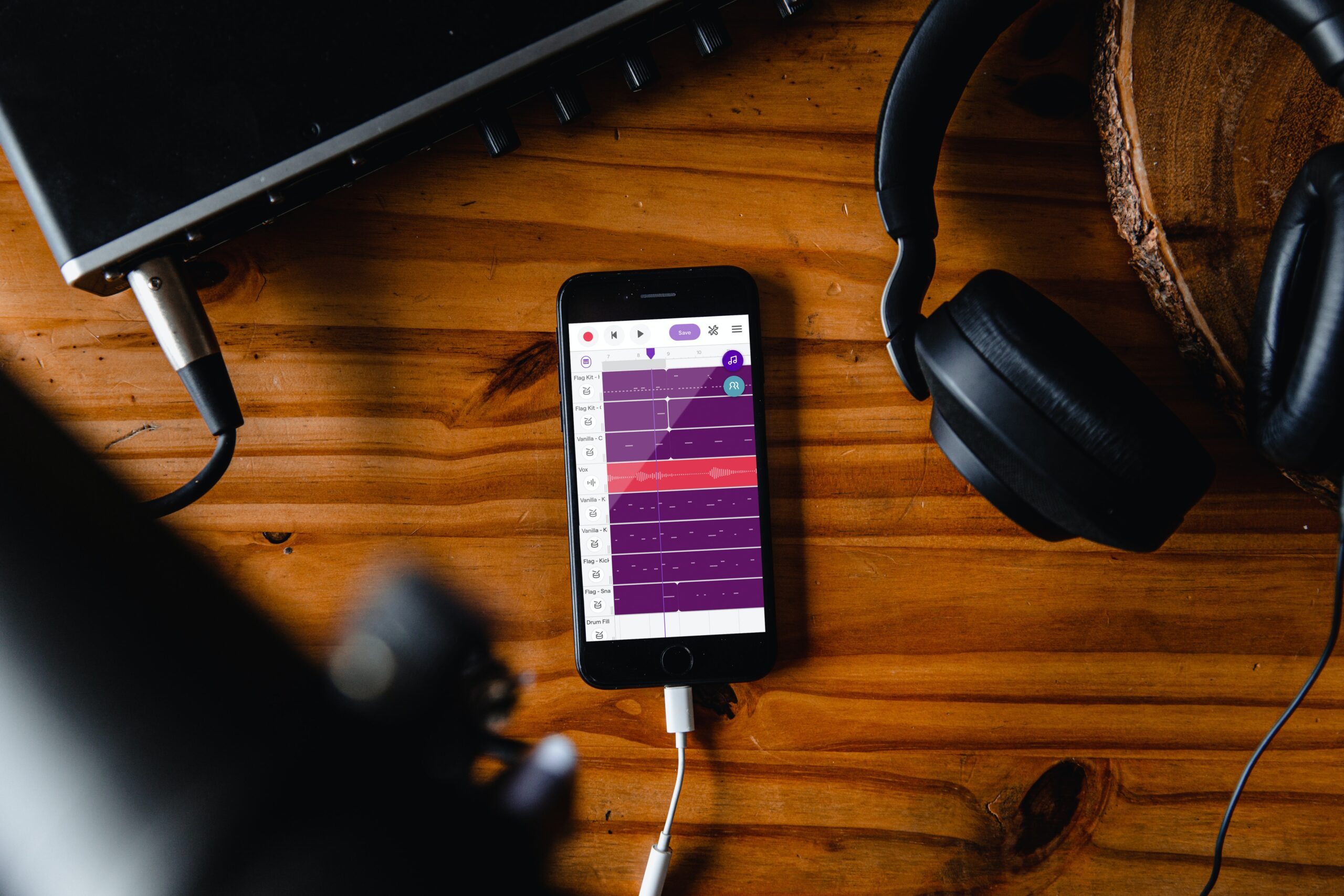 Mobile recording rig with an iphone, interface, headphones, and microphones