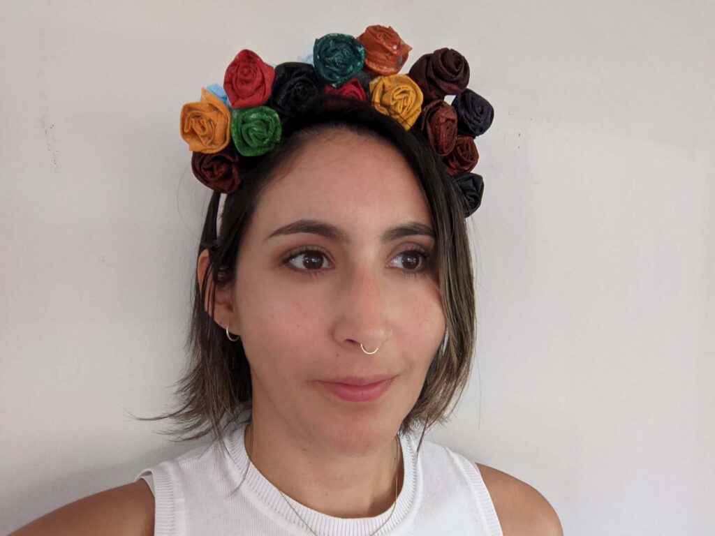 Person wearing flower crown made out of masks