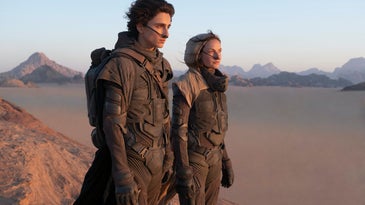 Dune 2021 movie actors looking across the desert of Arrakis