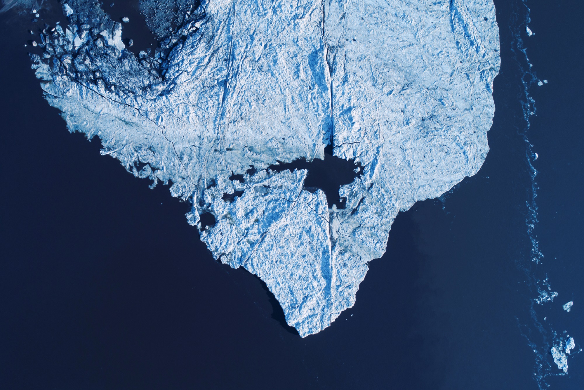 Melting ice cap in the ocean aerial