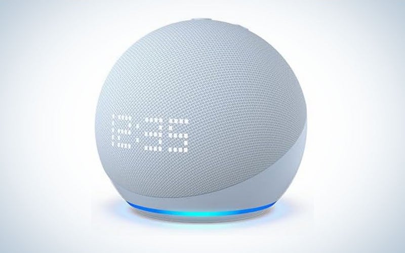 A blue Amazon Echo Dot 5th generation on a blue and white background