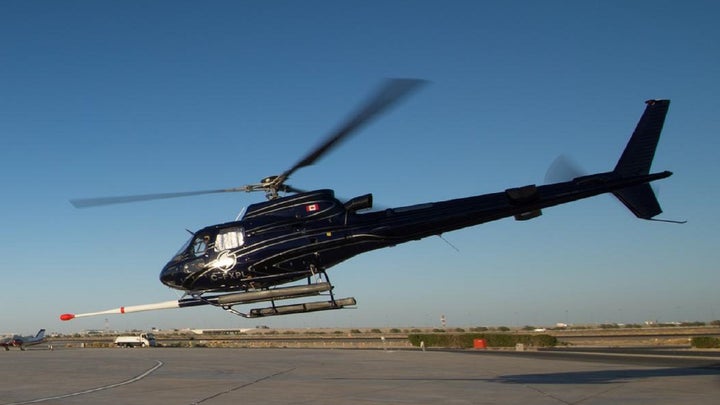 Earth MRI black helicopter with magnetic sensor on an airfield