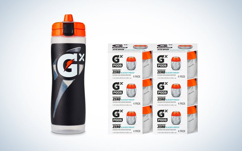 A GX bottle and concentrate pods on a blue and white background