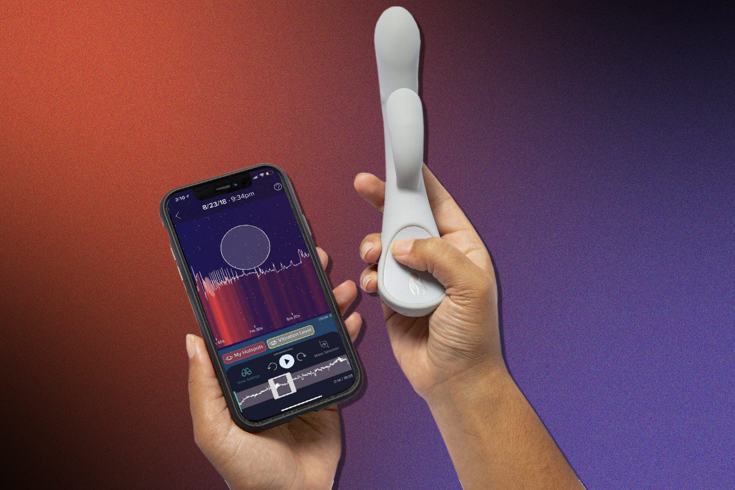hands hold a white vibrator and a phone displaying data