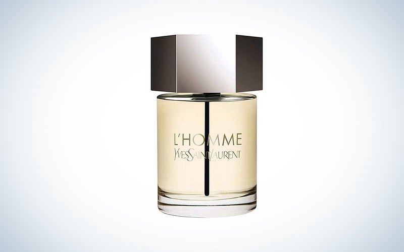 A bottle of YSL L'homme on a blue and white background