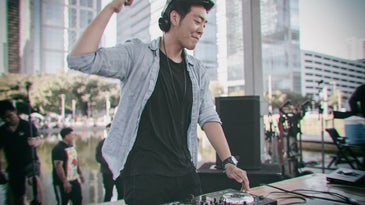 DJ in blue buttondown and black t-shirt