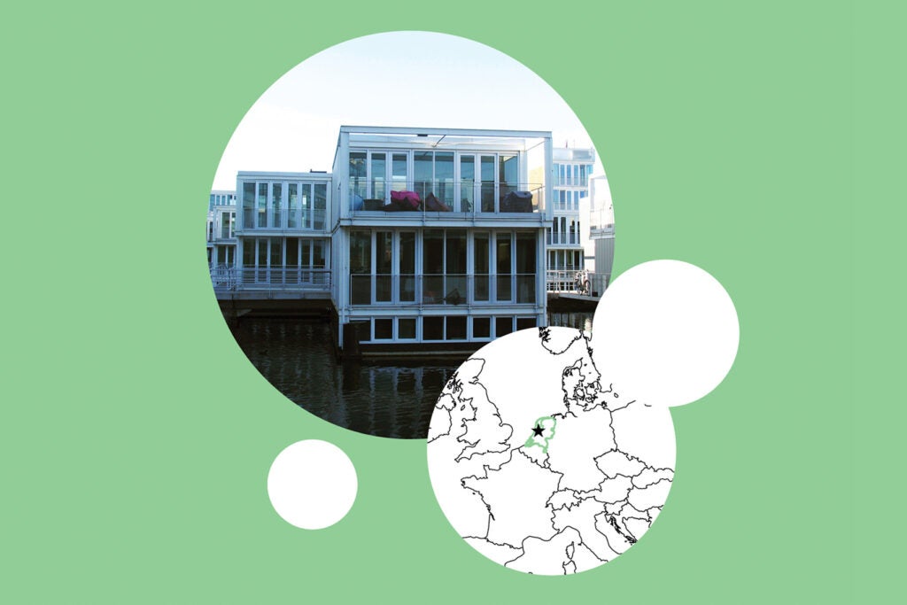 Glass floating building on artificial island in Amsterdam, The Netherlands, next to map on mint green background