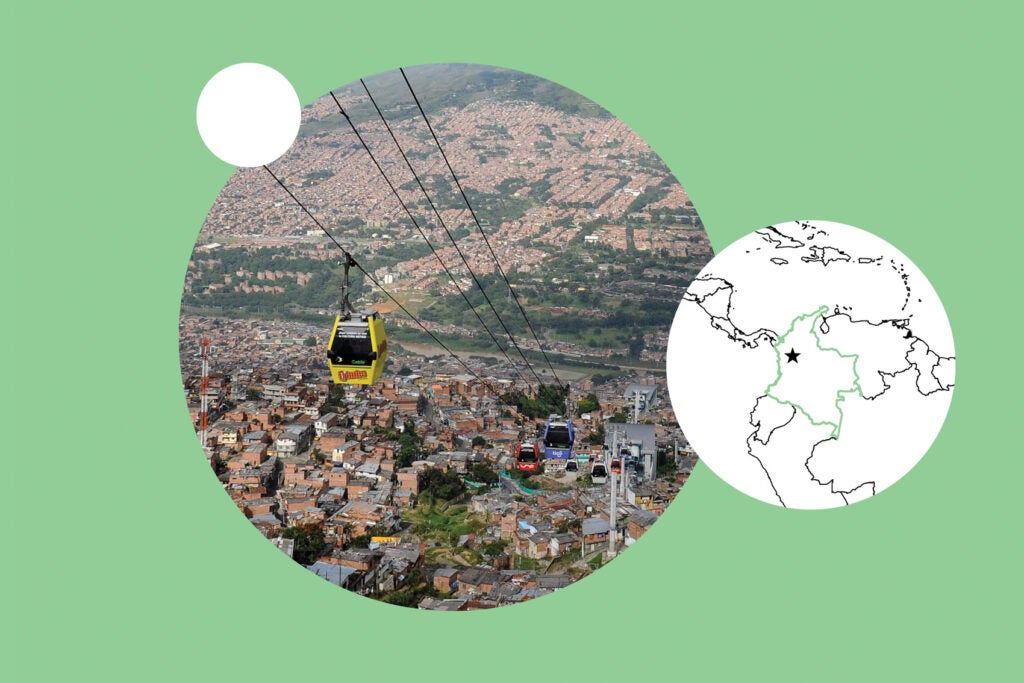 Yellow air tram over moutainous Medellin, Colombia, next to map on mint green background