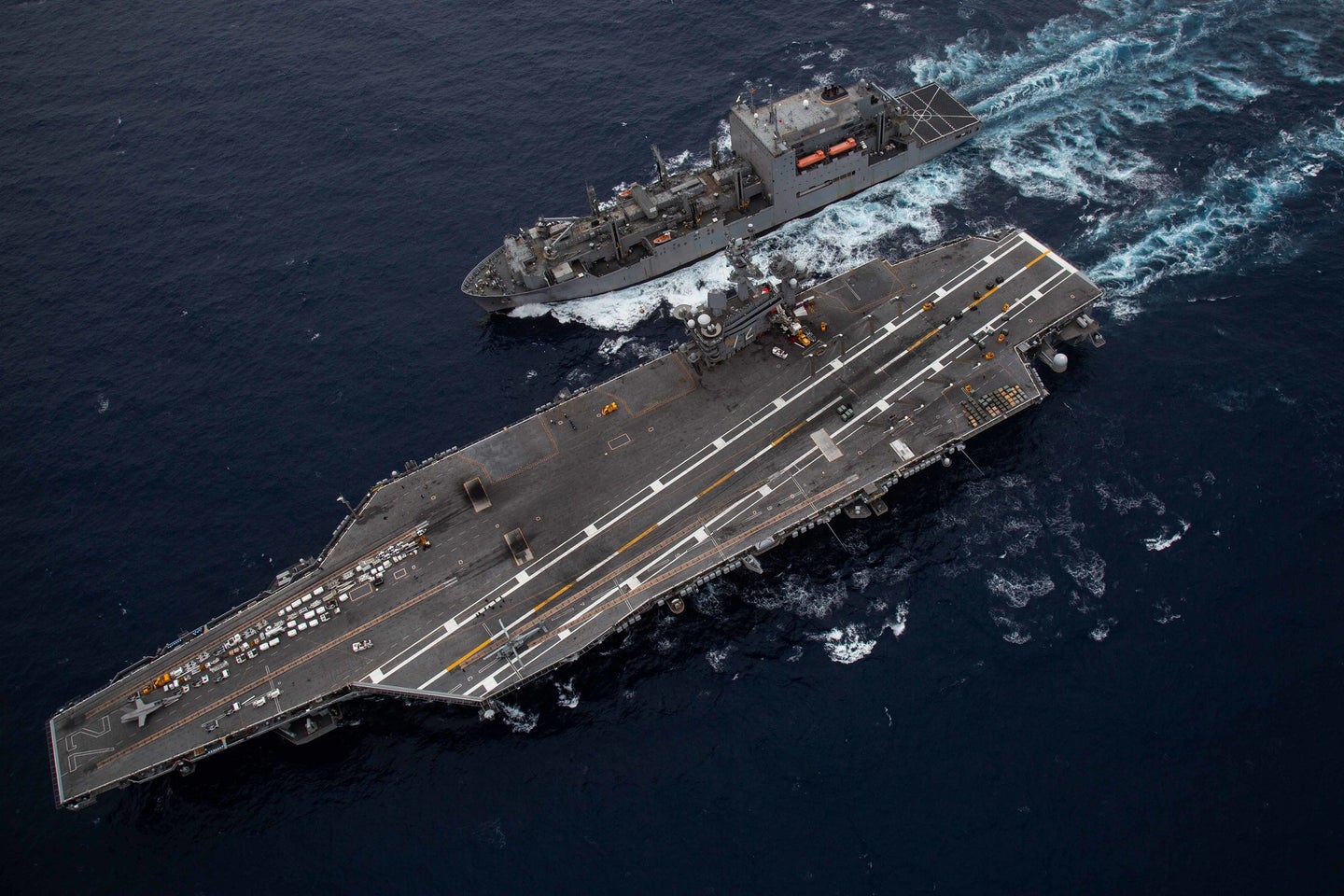 US Navy air craft carrier releasing greenhouse gas emissions over the Pacific Ocean