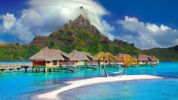 Ocean-front resort with mountain and blue waters