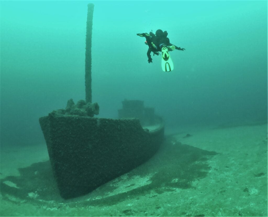 Shipwreck in blue-green waters at the bottom of Lake Michigan