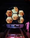 James Webb Space Telescope project scientists' face reflected in five hexagonal mirrors