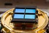 James Webb Space Telescope near-infrared camera on a gold plate with four blue cells