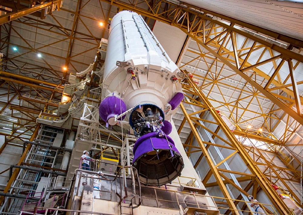 Ariane 5 rocket with purple boosters being prepared at the spaceport for the James Webb Space Telescope launch