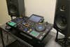 Pioneer XDJ-RX3 on a table with ADAM Audio monitors