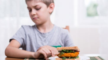 Young athletes often feel pressure to under-eat. Here's what parents can do about it.