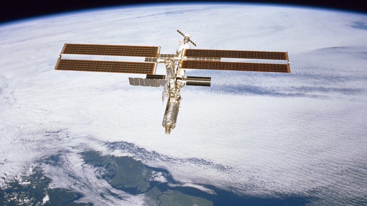 International Space Station now extended to 2030 in the Earth's lower orbit over clouds and South America