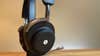 Master & Dynamic MG20 headphones on a stand at an angle