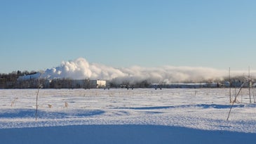 Low hanging cloud layer over snowy ground