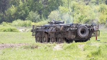 an armored personnel carrier in a field