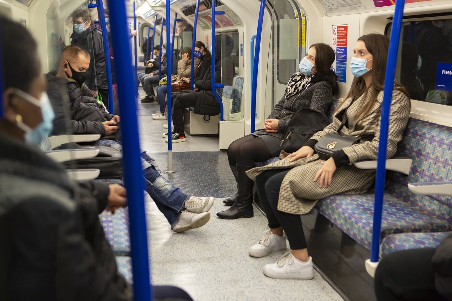 People wear COVID masks in on public transportation