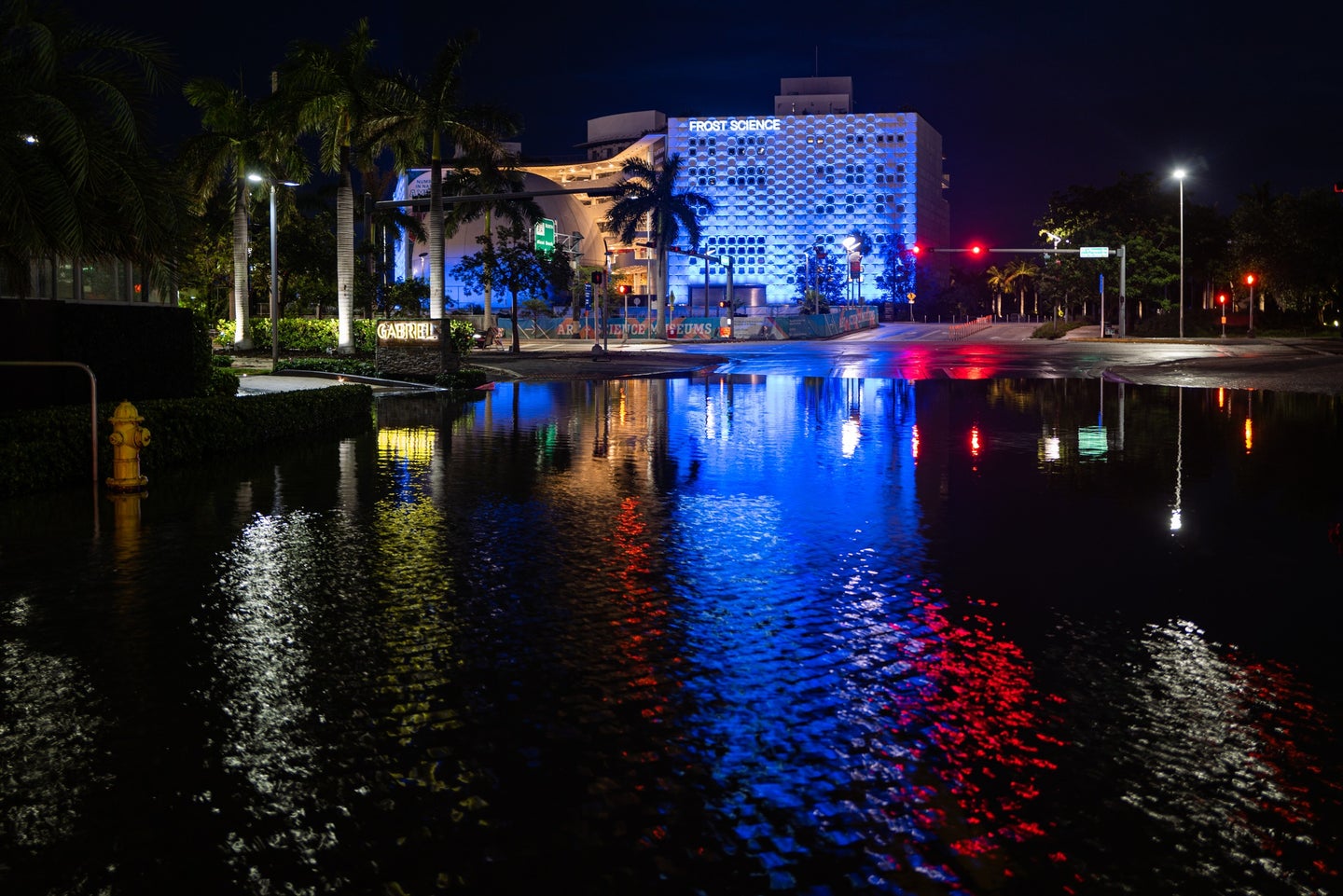 Flooded Miami street at night as an effect of sea level rise and coastal flooding