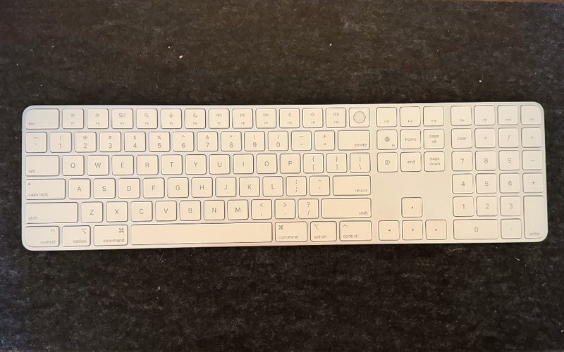 Apple Magic Keyboard with Touch ID and Numeric Keypad on a desk