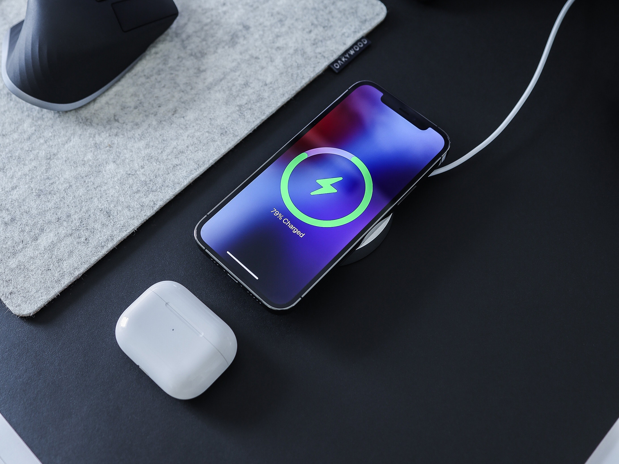 phone on desk charging wirelessly