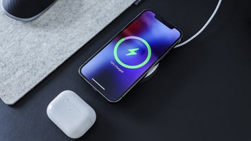 phone on desk charging wirelessly