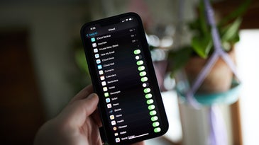 A picture of an iPhone 13 Pro Max on the settings screen for iCloud backup