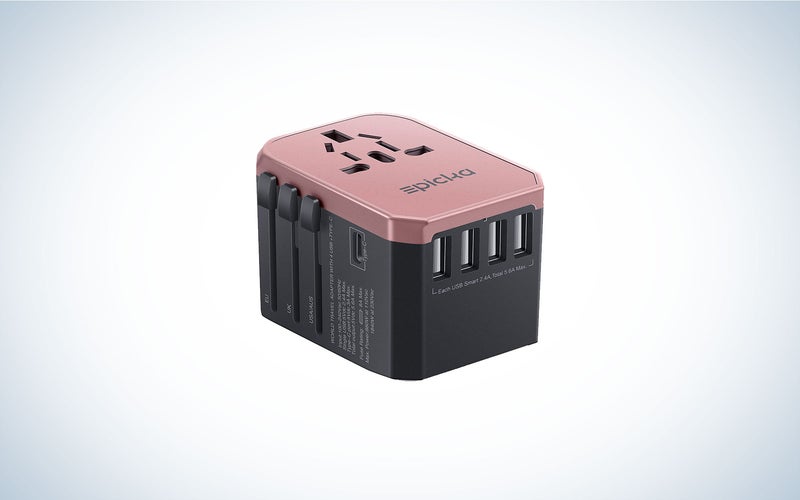 The Epicka All-in-one-universal travel power adapter is pink on the top and black on the bottom. It's one of the best travel accessories.