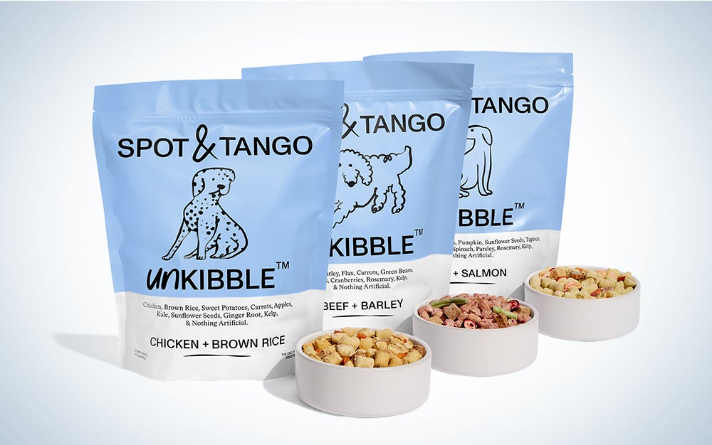 Bags of Spot and Tango kibble on a blue and white background