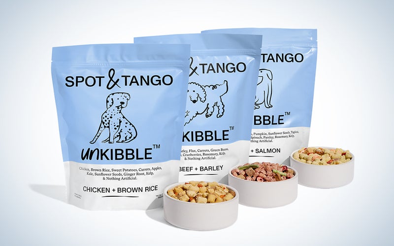 Bags of Spot and Tango kibble on a blue and white background