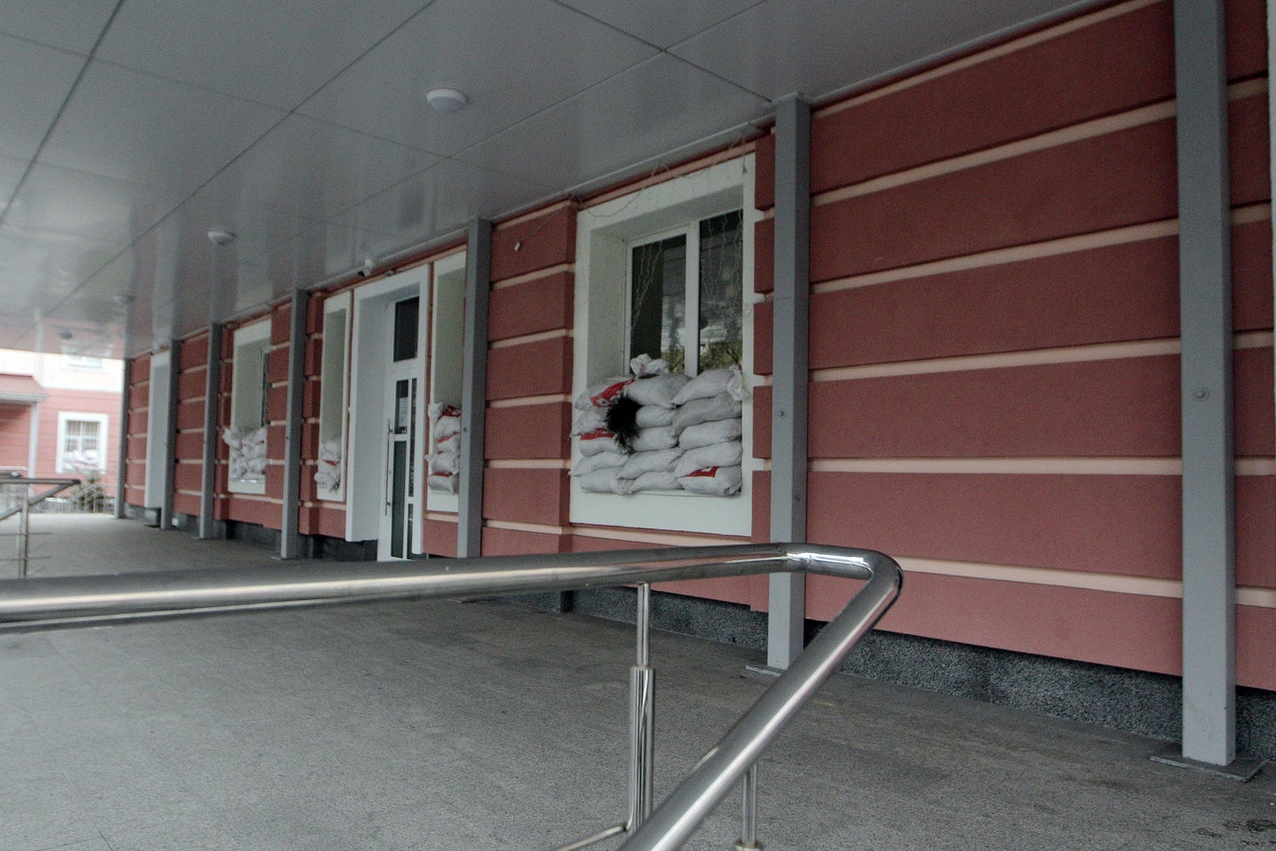 Outside of Kyiv maternity hospital with sandbags in windows due to Russian airstrikes on Ukraine